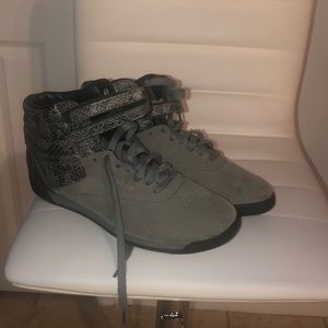 Suede upper and Snake print sneaker.